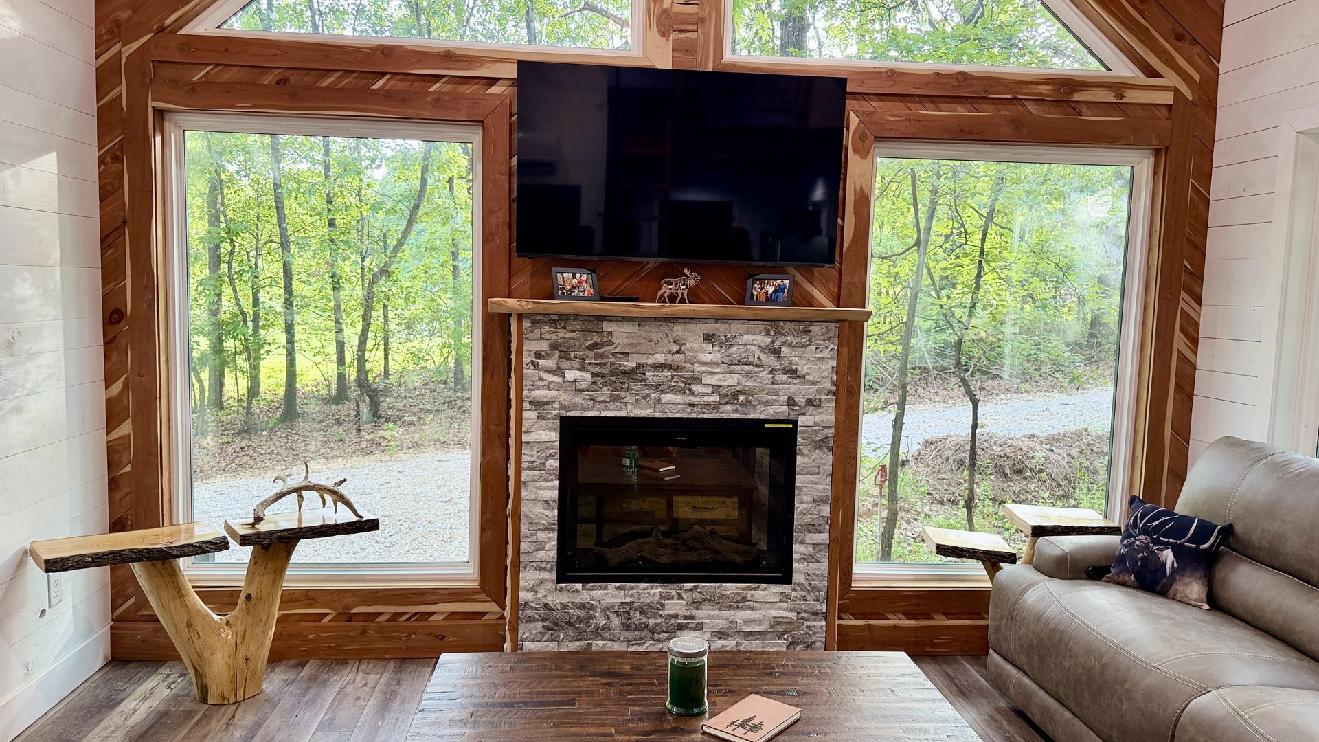 Living room with fireplace and TV